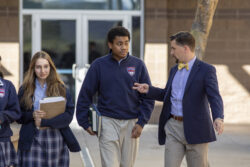 man with students